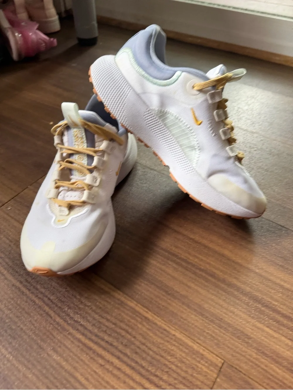 Nike Kids White Sneakers with Pale Yellow Accents